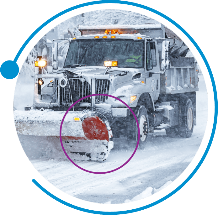 a municipal snowplow clears the roads
