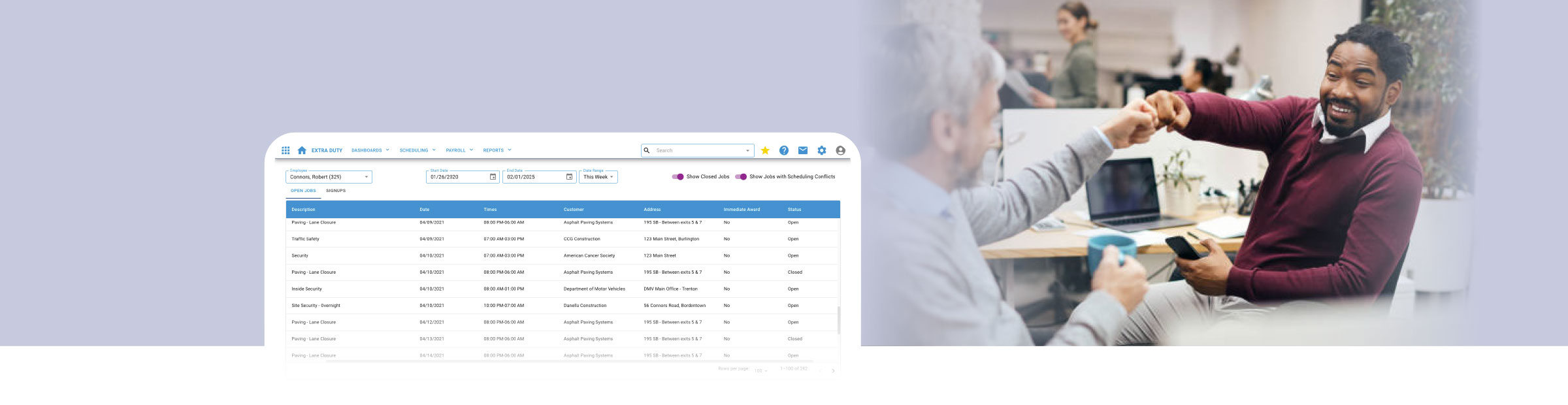two employees fist bump next to a productivity screenshot from the vcs system