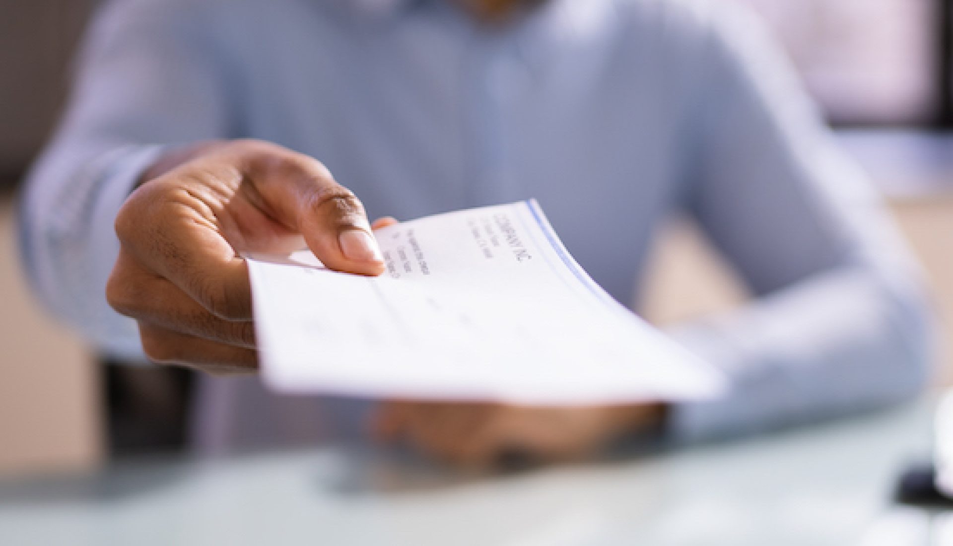 African American business woman Giving Paycheck